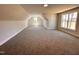 Large, sunlit bonus room with carpet flooring and multiple windows at 103 Roma Gora Ct, Princeton, NC 27569