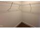 An empty closet featuring hanging racks perfect for storing your clothes and accessories at 103 Roma Gora Ct, Princeton, NC 27569