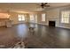Spacious living room with a fireplace, ample natural light, and open-concept design at 103 Roma Gora Ct, Princeton, NC 27569
