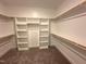 Well-organized walk-in closet with ample shelving and hanging space for all your wardrobe needs at 103 Roma Gora Ct, Princeton, NC 27569