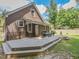 Exterior of brick home with a large deck for outdoor entertaining at 178 Paceville Rd, Selma, NC 27576