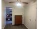 Well-lit bedroom featuring carpet, a dresser, ceiling fan and ensuite door at 178 Paceville Rd, Selma, NC 27576