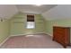 Bedroom with built-in shelving, neutral carpet, and a bright window at 178 Paceville Rd, Selma, NC 27576