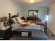 Comfortable bedroom featuring a well-made bed, carpet and wooden furniture at 178 Paceville Rd, Selma, NC 27576