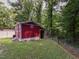 Backyard shed with a fenced perimeter at 178 Paceville Rd, Selma, NC 27576