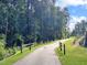 Paved road winds through a wooded community at 7130 Hubner Pl # 34, Cary, NC 27519