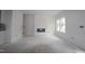 Bright living room featuring a modern fireplace and large windows at 7130 Hubner Pl # 34, Cary, NC 27519
