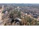 Aerial view of a neighborhood with lush trees and homes at 1208 Wimbleton Dr, Raleigh, NC 27609