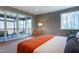 Bedroom with balcony access, modern furnishings and hardwood floors at 1208 Wimbleton Dr, Raleigh, NC 27609