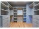 Spacious walk-in closet with built-in shelving and drawers for storage at 1208 Wimbleton Dr, Raleigh, NC 27609