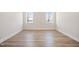 Bright bedroom with hardwood floors and natural light at 1221 Cricket St, Elon, NC 27244