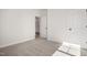Well-lit bedroom with neutral carpeting and closet at 1221 Cricket St, Elon, NC 27244