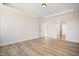 Spacious bedroom with hardwood floors and access to bathroom at 1221 Cricket St, Elon, NC 27244
