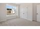 Bedroom with double-door closet and large window at 1221 Cricket St, Elon, NC 27244
