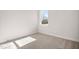 Spacious bedroom with neutral carpeting and large window at 1221 Cricket St, Elon, NC 27244