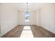 Formal dining room with hardwood floors and wainscoting at 1221 Cricket St, Elon, NC 27244