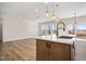 Modern kitchen with a large island and sink overlooking backyard at 1221 Cricket St, Elon, NC 27244