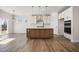 Modern kitchen with island and stainless steel appliances at 1221 Cricket St, Elon, NC 27244