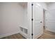 Laundry room with built-in bench and additional storage at 1221 Cricket St, Elon, NC 27244