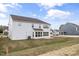 Expansive backyard with freshly laid sod, a concrete patio, and ample space at 1233 Cricket St, Elon, NC 27244