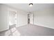 Carpeted bedroom with natural light featuring an entrance to a walk in closet at 1233 Cricket St, Elon, NC 27244