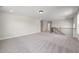 Spacious bonus room with neutral carpet and trim, ready for customization at 1233 Cricket St, Elon, NC 27244