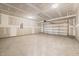 Spacious unfinished garage with concrete floor and insulated walls, ready for customization at 1233 Cricket St, Elon, NC 27244