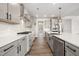 Modern kitchen featuring stainless steel appliances, gray cabinetry, and a stylish subway tile backsplash at 1233 Cricket St, Elon, NC 27244