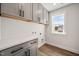 Well-organized laundry room with storage cabinets and a stylish countertop at 1233 Cricket St, Elon, NC 27244