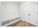 Mudroom featuring built-in bench with cubbies for storage and closet, perfect for organization at 1233 Cricket St, Elon, NC 27244
