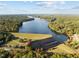 Aerial view of lakefront community with homes and lush green landscape at 138 Ottawa Dr, Louisburg, NC 27549