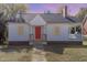 White house with red front door, grey roof and small yard at 619 N Mebane St, Burlington, NC 27217