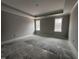 Spacious bedroom with neutral-colored walls and two windows at 700 Tuscany Cir, Princeton, NC 27569