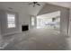 Bright living room boasting a fireplace, a vaulted ceiling, and an open layout to the kitchen at 700 Tuscany Cir, Princeton, NC 27569