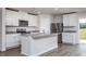 Modern kitchen featuring white cabinets, stainless steel appliances, and granite countertops at 11320 International Dr, Middlesex, NC 27557