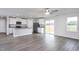 Modern kitchen with stainless steel appliances, gray granite countertops, and sleek white cabinetry at 11320 International Dr, Middlesex, NC 27557