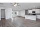 Living room with hardwood floors and white kitchen at 11320 International Dr, Middlesex, NC 27557