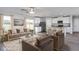 Open-concept living room featuring hardwood floors, lots of natural light, and modern decor at 11320 International Dr, Middlesex, NC 27557
