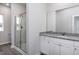 Bathroom featuring granite countertops, large mirror, and glass shower at 11340 International Dr, Middlesex, NC 27557