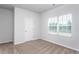 Bright bedroom with a window at 11340 International Dr, Middlesex, NC 27557