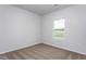 Neutral bedroom with a window showing the outdoors at 11340 International Dr, Middlesex, NC 27557