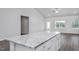 Kitchen island featuring granite countertops at 11340 International Dr, Middlesex, NC 27557