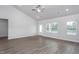 Bright living room features vaulted ceilings, natural light, and stylish wood-look flooring at 11340 International Dr, Middlesex, NC 27557