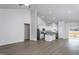 Bright living space flows into a kitchen with granite countertops and stainless steel appliances at 11340 International Dr, Middlesex, NC 27557
