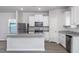 Modern kitchen features stainless steel appliances, granite countertops and a center island at 11360 International Dr, Middlesex, NC 27557