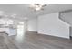 Open floorplan showing living room and kitchen with a granite countertop island at 11360 International Dr, Middlesex, NC 27557