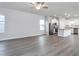 Open floorplan of a living room and kitchen with granite countertop breakfast bar at 11360 International Dr, Middlesex, NC 27557