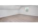 Neutral bedroom with carpeted floor, sloped ceiling, and one window for natural light at 11376 International Dr, Middlesex, NC 27557