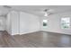 Well-lit living room featuring modern luxury vinyl plank flooring and neutral color palette at 11376 International Dr, Middlesex, NC 27557