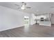 Open concept living room with luxury vinyl plank flooring and stainless steel kitchen appliances at 11376 International Dr, Middlesex, NC 27557
